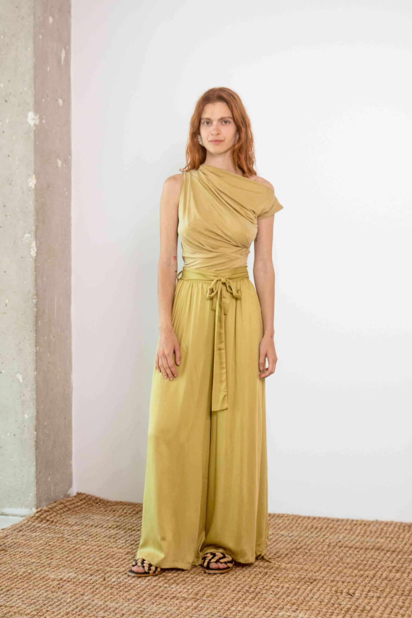  Wide Ecovero Trousers in Soft Olive showcased from the back, featuring a relaxed flowy fit.