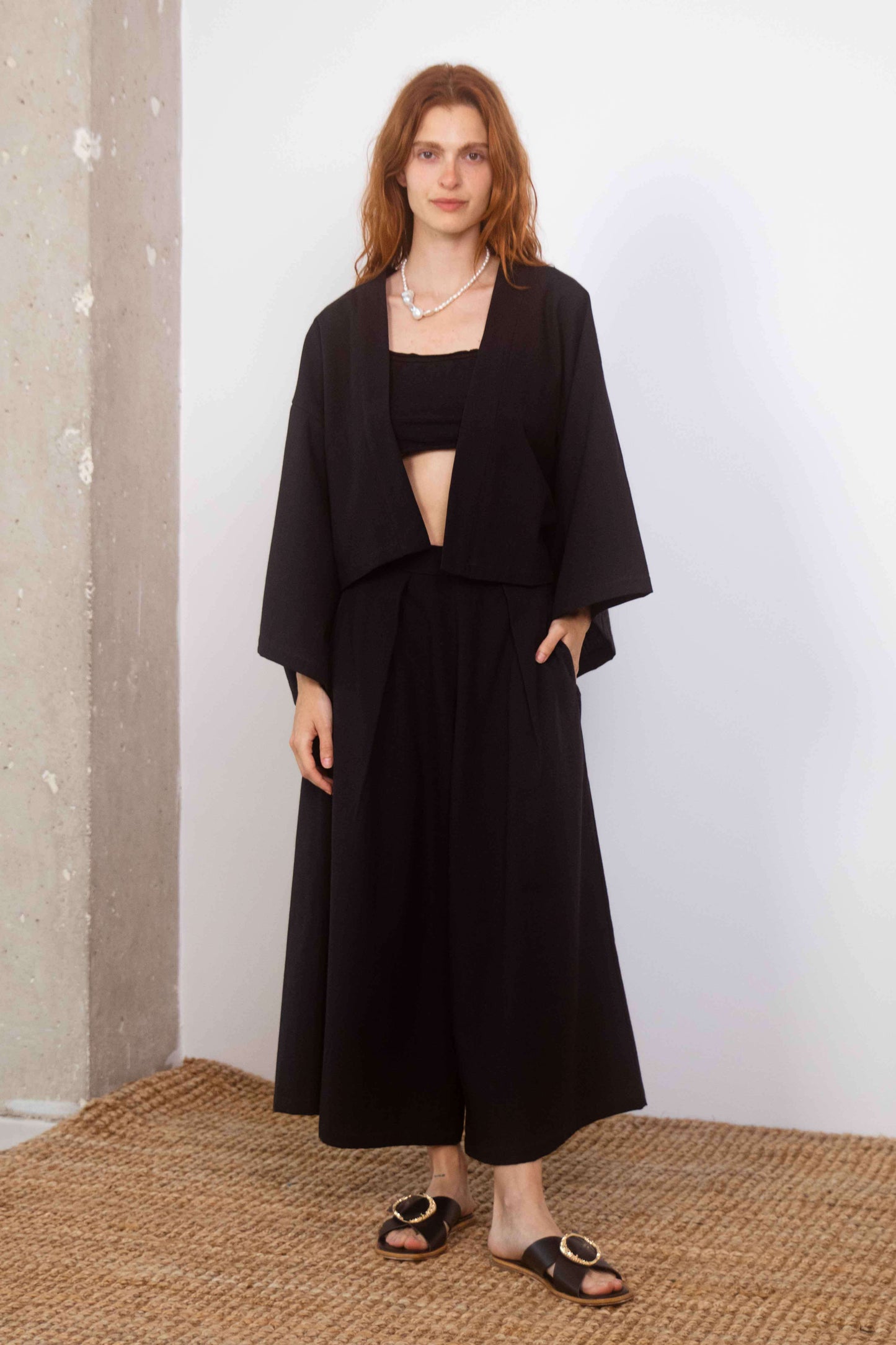 Woman wearing a Organic Cotton Kimono Jacket with relaxed silhouette and sustainable design.