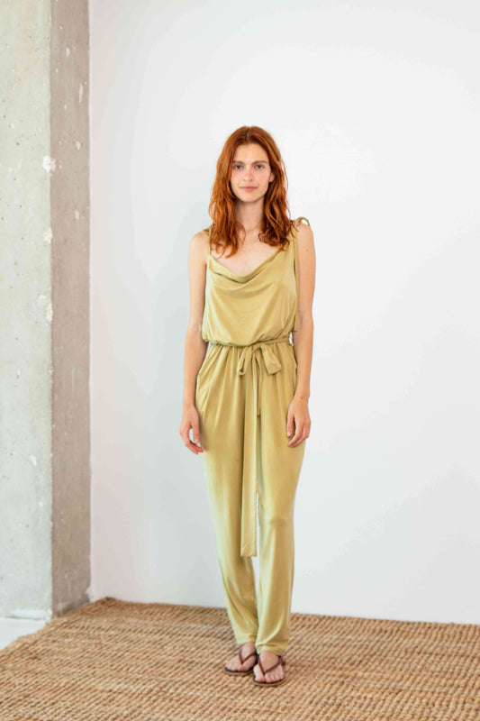 Cupro Slip Jumpsuit in soft olive with belt, showcasing relaxed elegance and modern design.