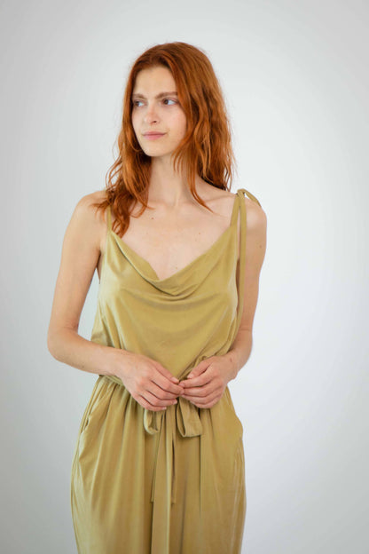 Cupro Slip Jumpsuit in olive featuring slim cami straps and a detachable belt, showcasing a relaxed elegance.