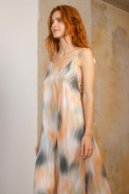 Model wearing a Printed Ecovero Viscose Maxi Dress with a flowy design and soft colors, perfect for Spring-Summer 2026.