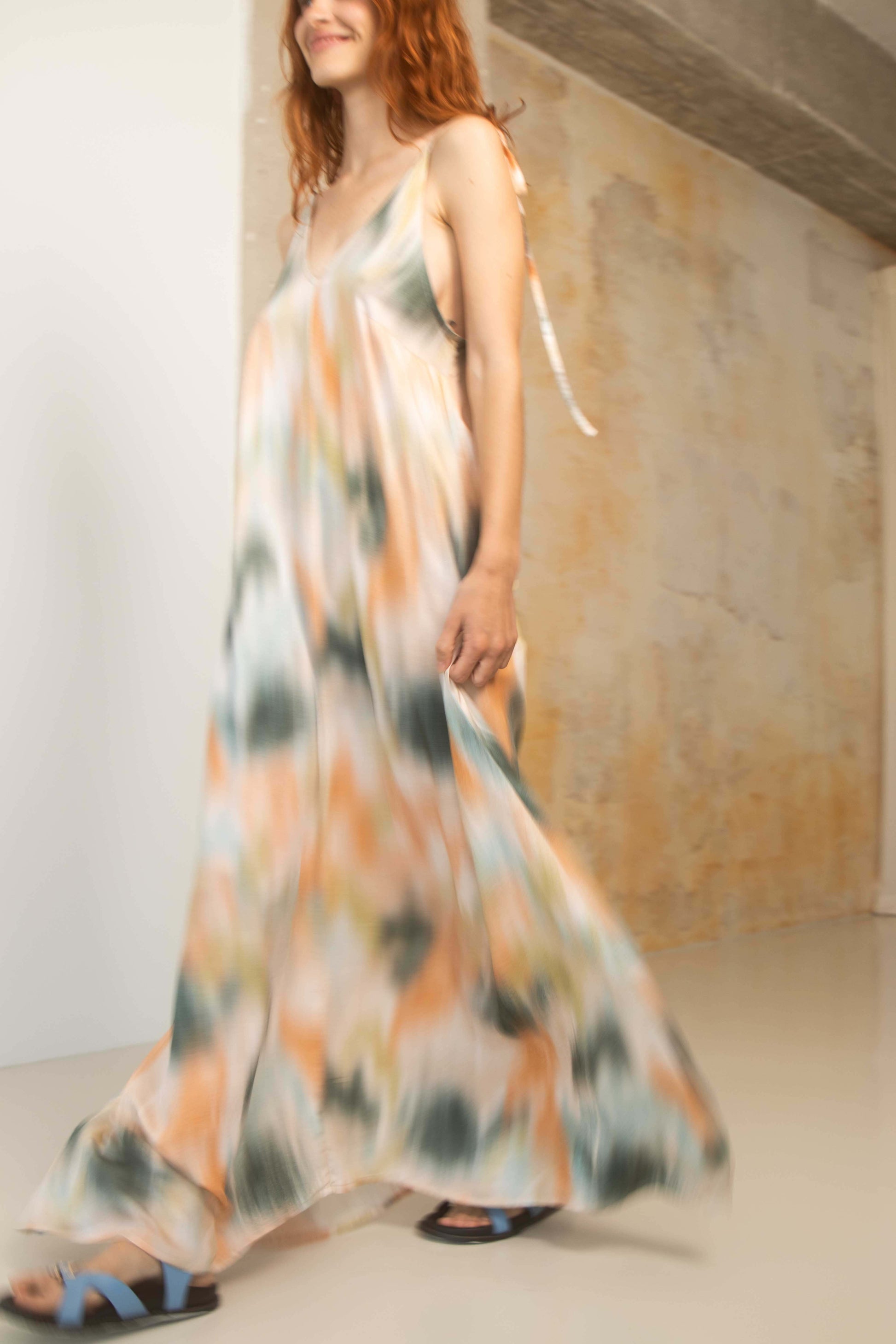 Model wearing a Printed Ecovero Viscose Maxi Dress, showcasing its fluid design and vibrant colors.