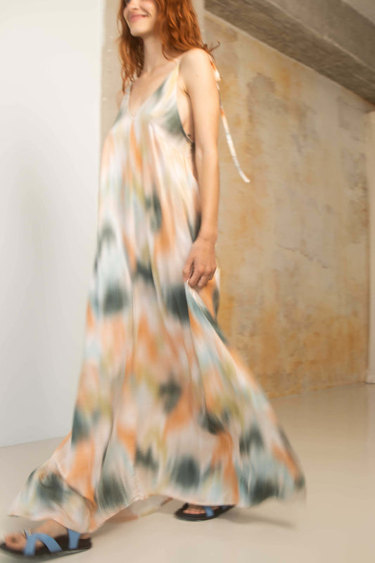 Model wearing a Printed Ecovero Viscose Maxi Dress, showcasing its fluid design and vibrant colors.