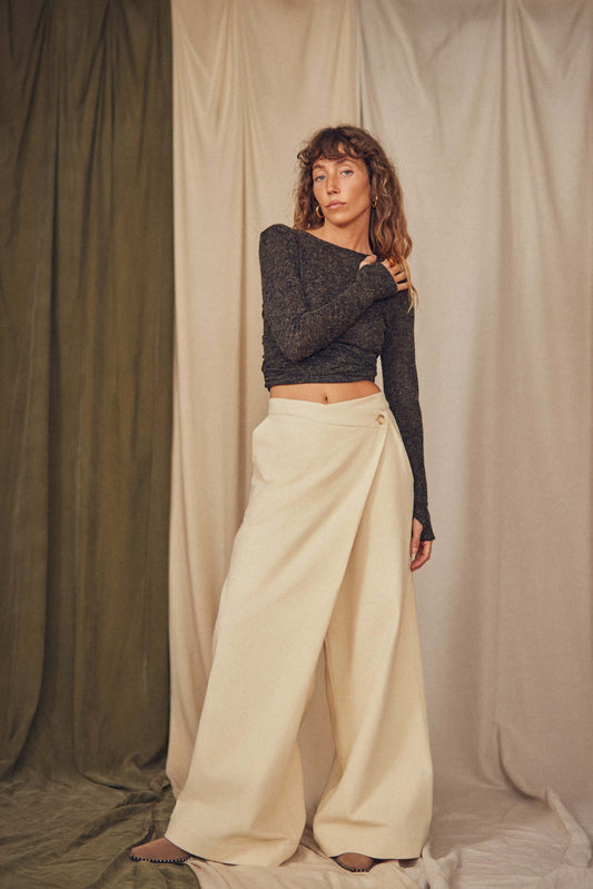 Woman wearing oat wrap trousers.