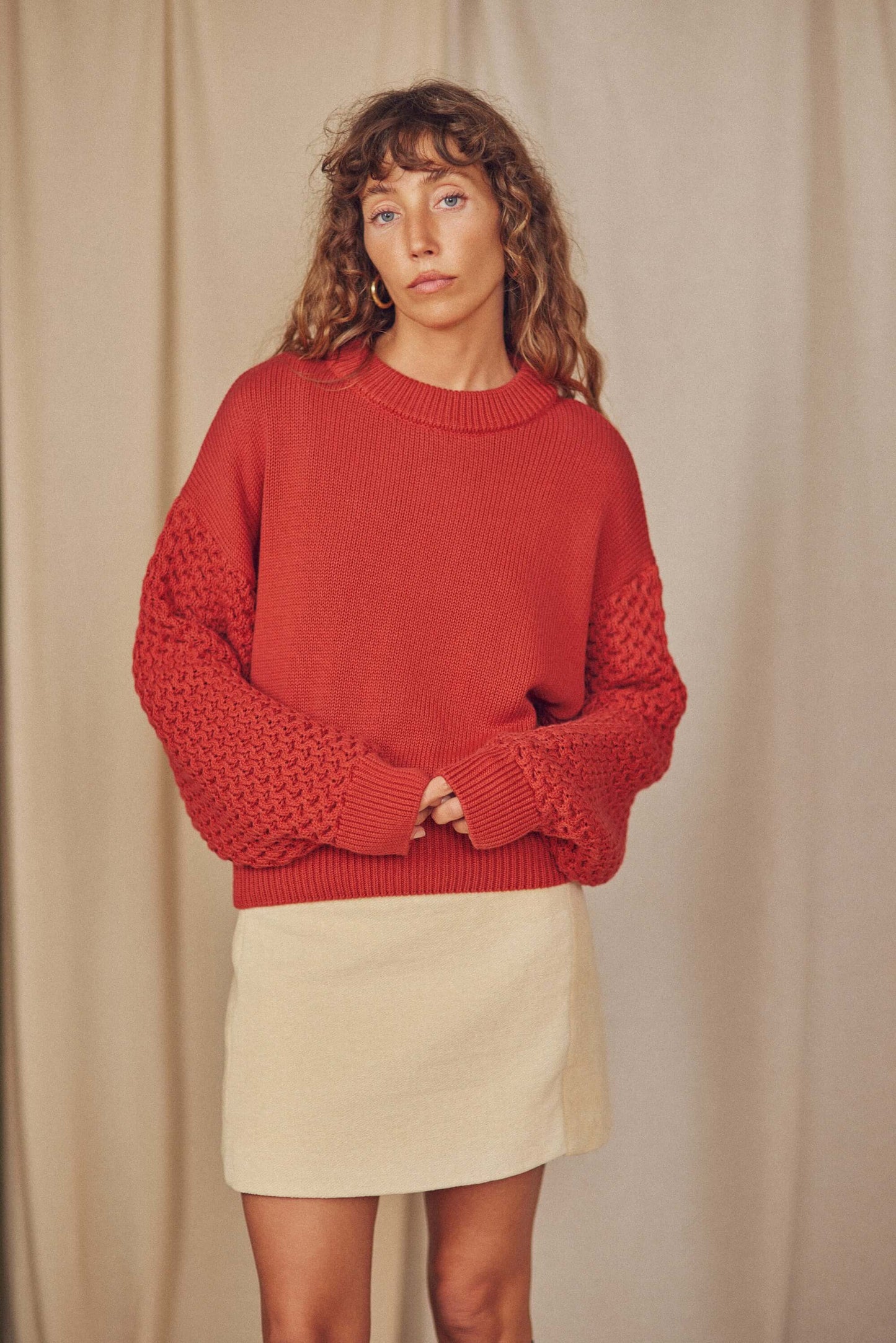 Heavy Knit Rust Vegan Sweater featuring unique fantasy sleeves and a modern silhouette.
