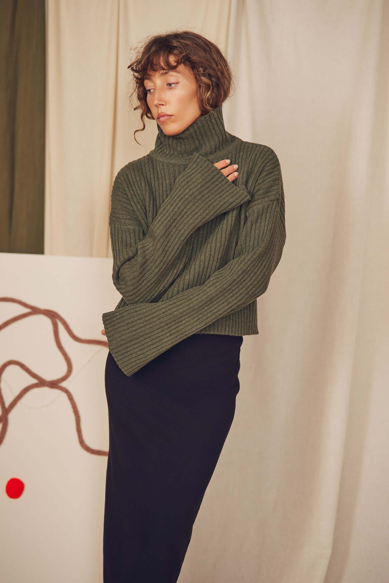 Khaki Heavy Knitted Wool Sweater featuring a ribbed texture and cozy turtleneck design, perfect for autumn layering.