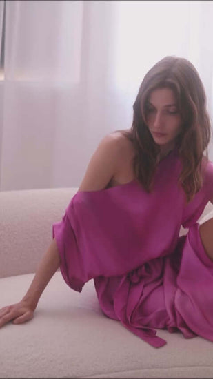 Model wearing a stylish off-shoulder pink printed midi dress, showcasing its soft, breathable Ecovero viscose fabric.