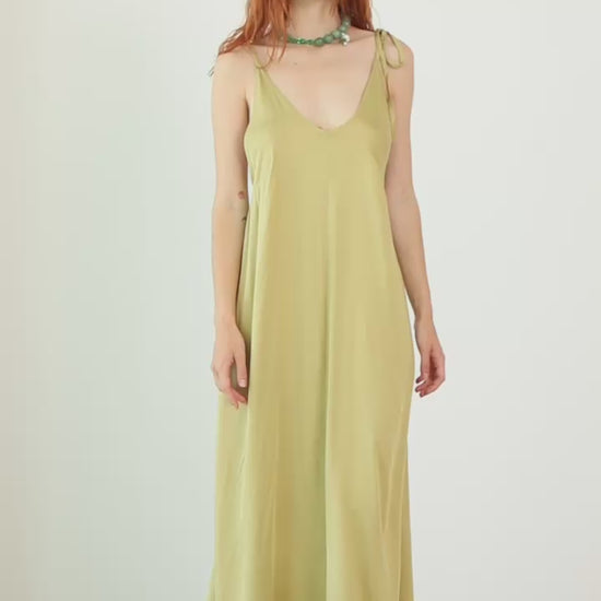 Volume Maxi Dress in Ecovero Viscose worn by a model, showcasing its fluid design in soft olive color.