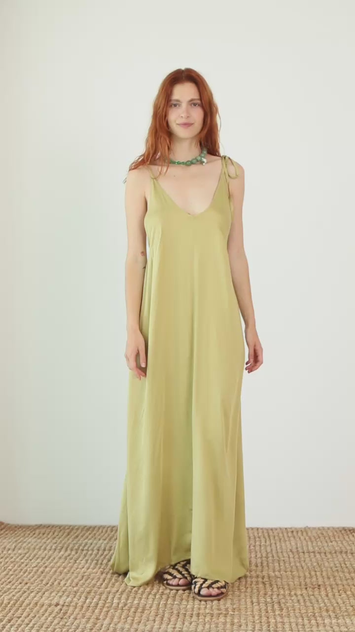Volume Maxi Dress in Ecovero Viscose worn by a model, showcasing its fluid design in soft olive color.