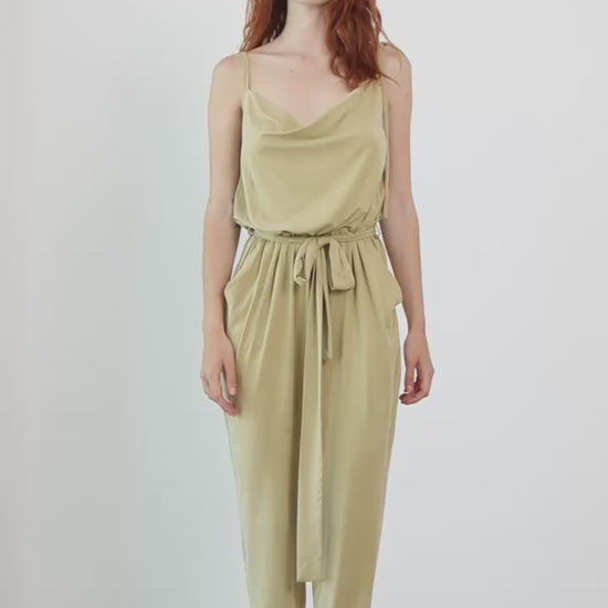 Cupro Slip Cami Jumpsuit with Belt in Olive worn by a model, showcasing its modern, relaxed design and elegant drape.