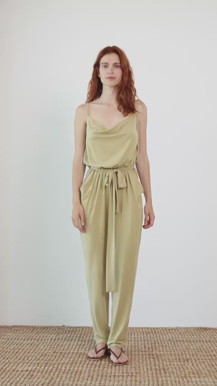Cupro Slip Cami Jumpsuit with Belt in Olive worn by a model, showcasing its modern, relaxed design and elegant drape.