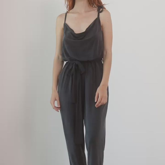 Cupro Slip Cami Jumpsuit with Belt in Slate Black worn by a model, showcasing relaxed elegance and modern style.