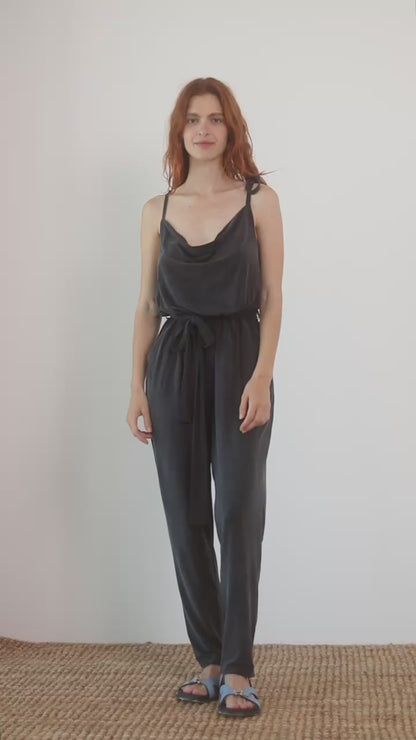 Cupro Slip Cami Jumpsuit with Belt in Slate Black worn by a model, showcasing relaxed elegance and modern style.