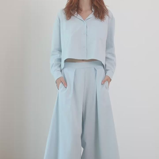 Model wearing Wide Culottes in Organic Cotton in Pale Blue with a matching cropped shirt.