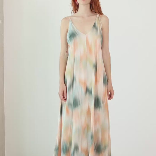 Model wearing a Printed Ecovero Viscose Maxi Dress with adjustable straps in a soft, fluid design and seasonal print.