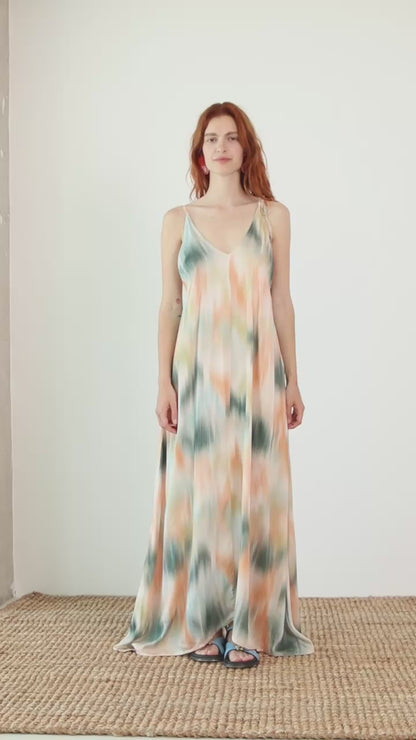 Model wearing a Printed Ecovero Viscose Maxi Dress with adjustable straps in a soft, fluid design and seasonal print.