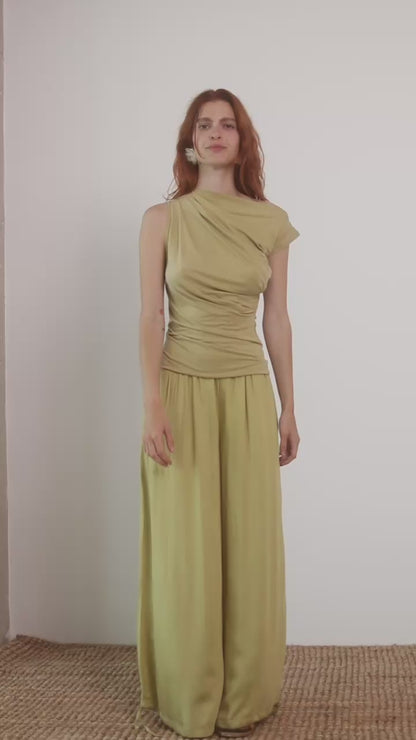 Wide Ecovero Trousers in Soft Olive modeled by a model, showcasing a relaxed oversized silhouette.