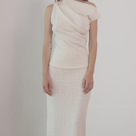 Model wearing Banana Pineapple Drape Neckline Top in Ecru with draped neckline and elegant styling.