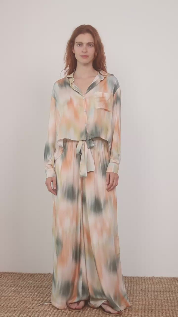 Printed Cropped Ecovero Viscose Oversized Shirt displayed in a fluid, multicolored design on a model.